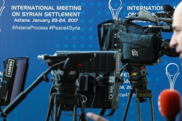 Reporters work in the media center set for Syria peace talks, in Astana, Kazakhstan, January 23, 2017.  REUTERS/Mukhtar Kholdorbekov