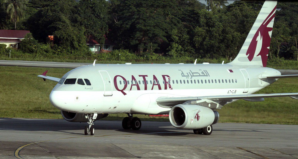 A Qatar Airways plane sits on the tarmac at Yangon International Airport in Yangon, Myanmar, Thursday, Oct. 4, 2012. Qatar Airways will resume flying to Myanmar's biggest city in the latest indicator of international interest in the Southeast Asian nation as it boosts its welcome to investors and tourism. The airline said in a statement Wednesday that it will relaunch its Doha-Yangon route that had been suspended in January 2008. It said the thrice-weekly flights will resume this Friday. (AP Photo/Khin Maung Win)/MYN101/248037477813/1210041007