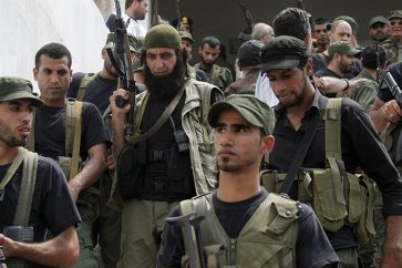 Palestinian gunmen from different factions hold their weapons during the launch of a joint security force that includes all Palestinian factions, to maintain stability at the Ain al-Hilweh Palestinian refugee camp near the port-city of Sidon, southern Lebanon July 8, 2014.
REUTERS/Ali Hashisho (LEBANON - Tags: POLITICS MILITARY) - RTR3XMS5